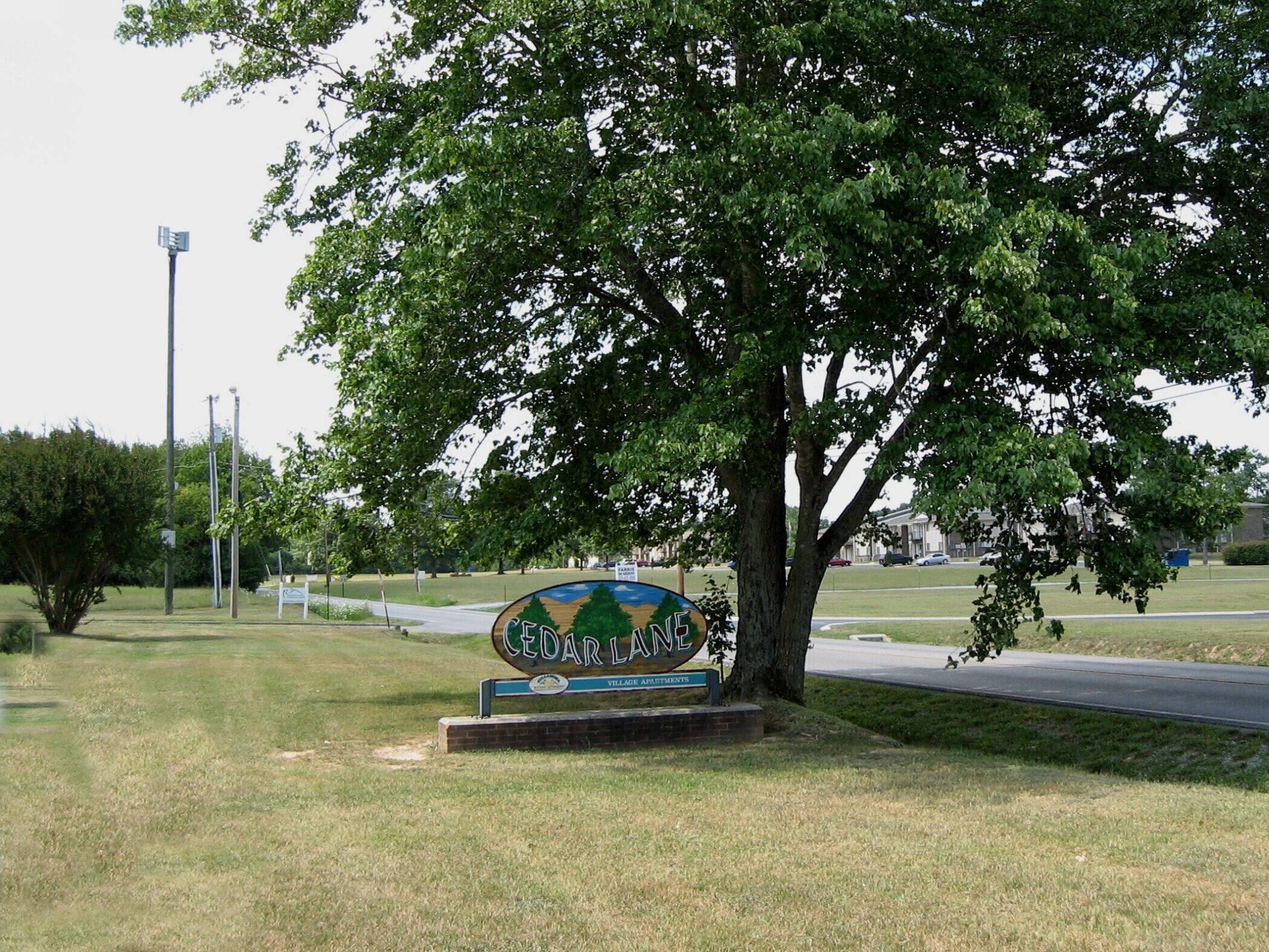 Cedar Lane Village Property Sign